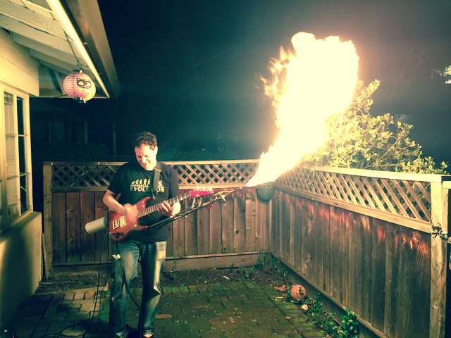 Luca Baldini with a flame throwing guitar